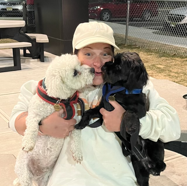 Jennifer holding two pets during a journey